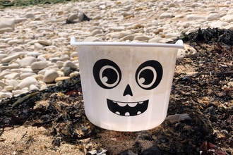 plastic bucket on beach