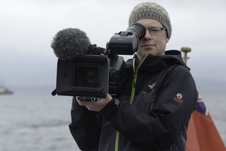 Videographer Raymond Besant filming on board Sula Crion. July 2011. - Chris Gomersall/2020VISION