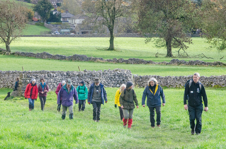 CEO Rachael Bice walking with Grass Wood volunteers