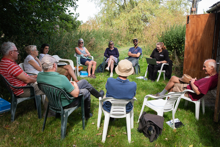 Clare with the Skerne volunteer team, seated and talking
