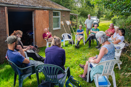 Jon with the team at Skerne, seated and talking