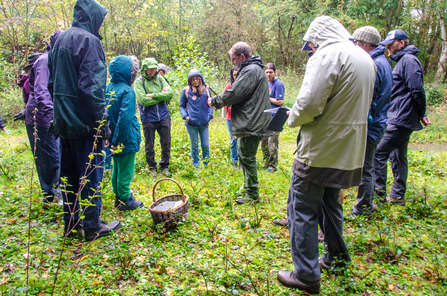 Group of people in woodland on a fungi ID walk