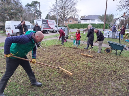 Group of residentds all coming together to manage an area of grass to improve it for wildlife and the community