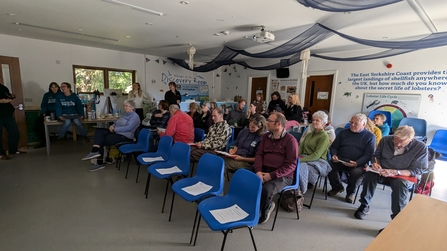 Volunteers engaged in a quiz at the marine conference