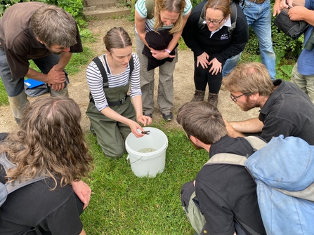 Crayfish officer showing people a white-clawed crayfish