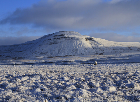 Snow covered mountain and limestone pavement in the Yorkshire Dales