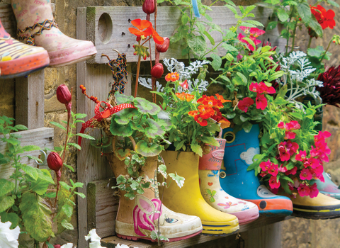 Welly planters overflowing with wildflowers